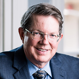 Headshot of Arnold L. Fenrich.
