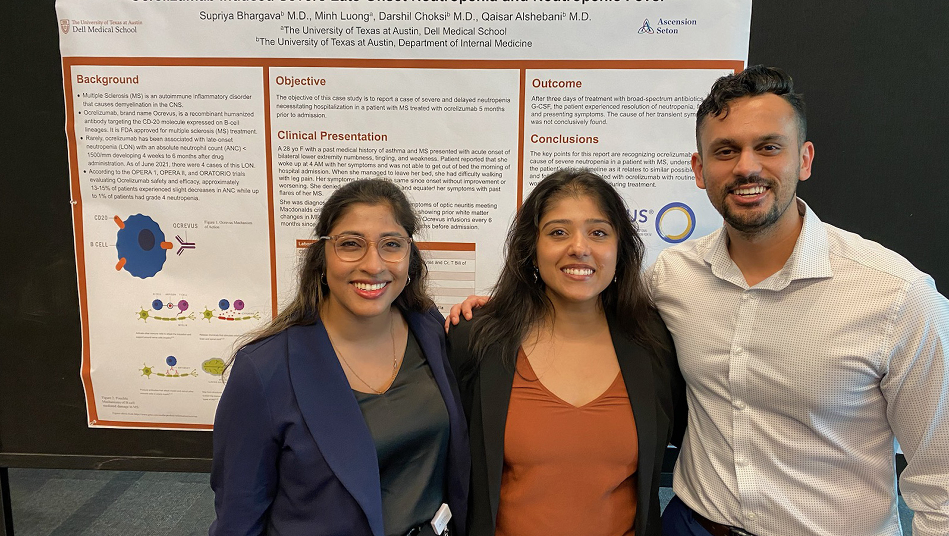 Internal medicine residents present a research poster.