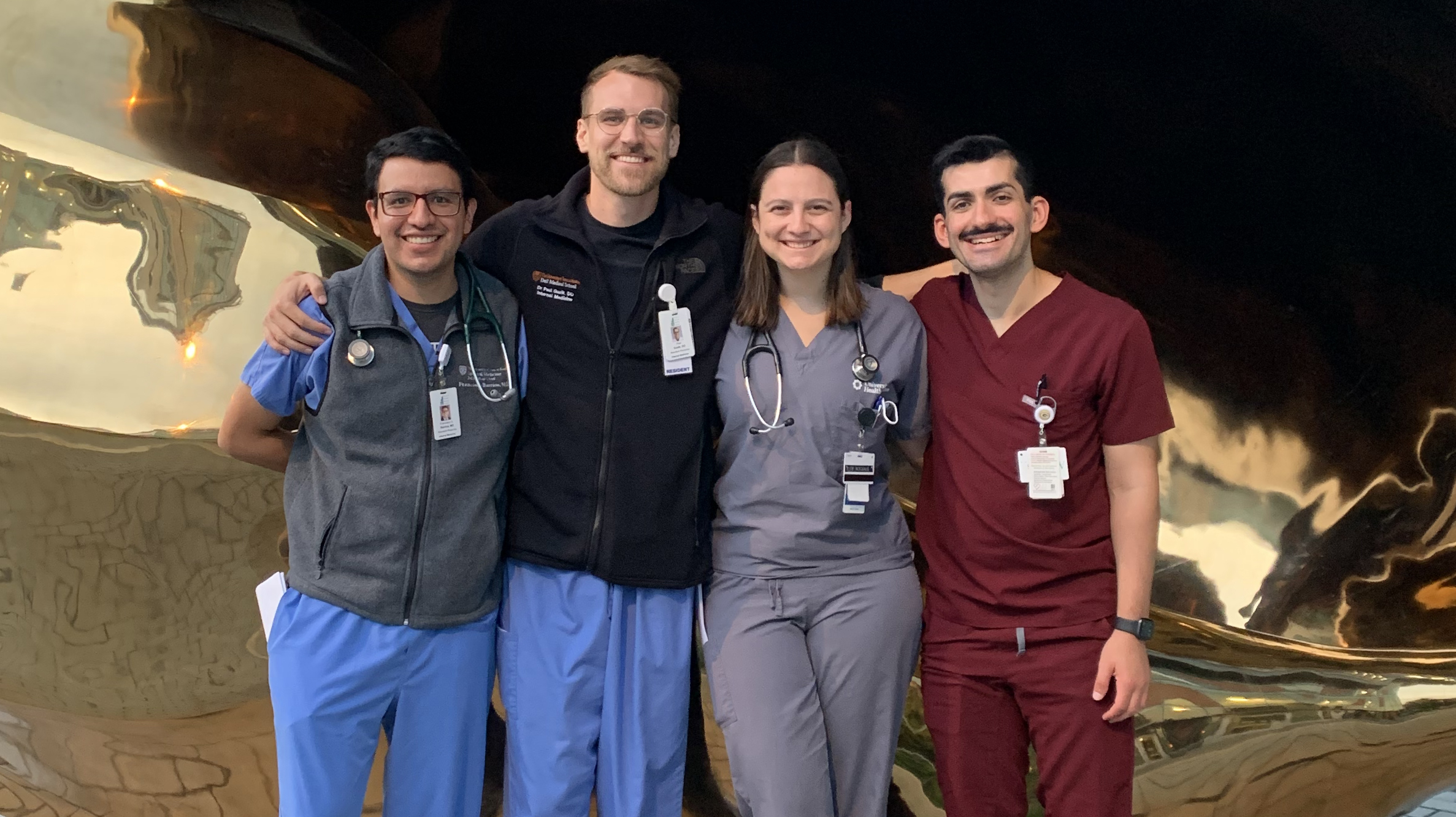 Former resident Francisco Barrios poses for a group photo with three other residents.
