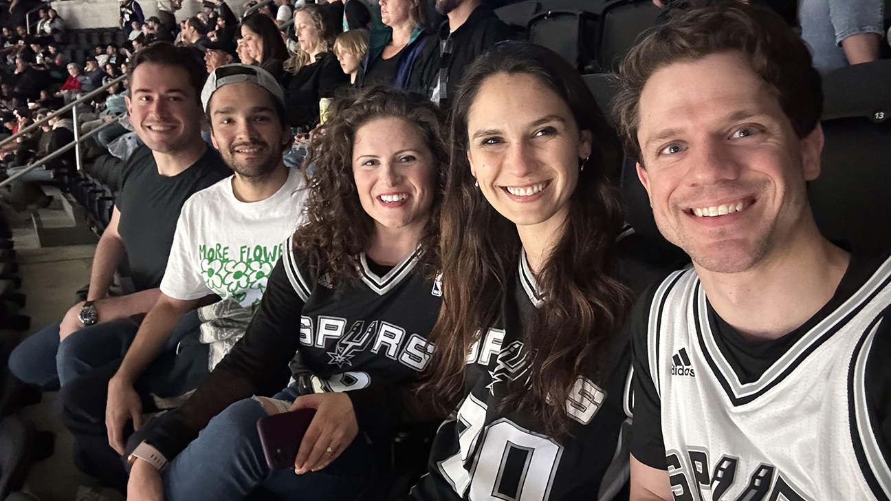 Morgan Gaither (center) with co-residents at Spurs game.